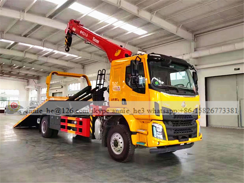 Isuzu flatbed tow truck