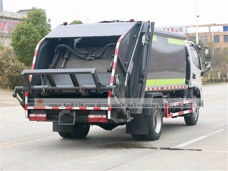 Rear side of garbage compactor truck